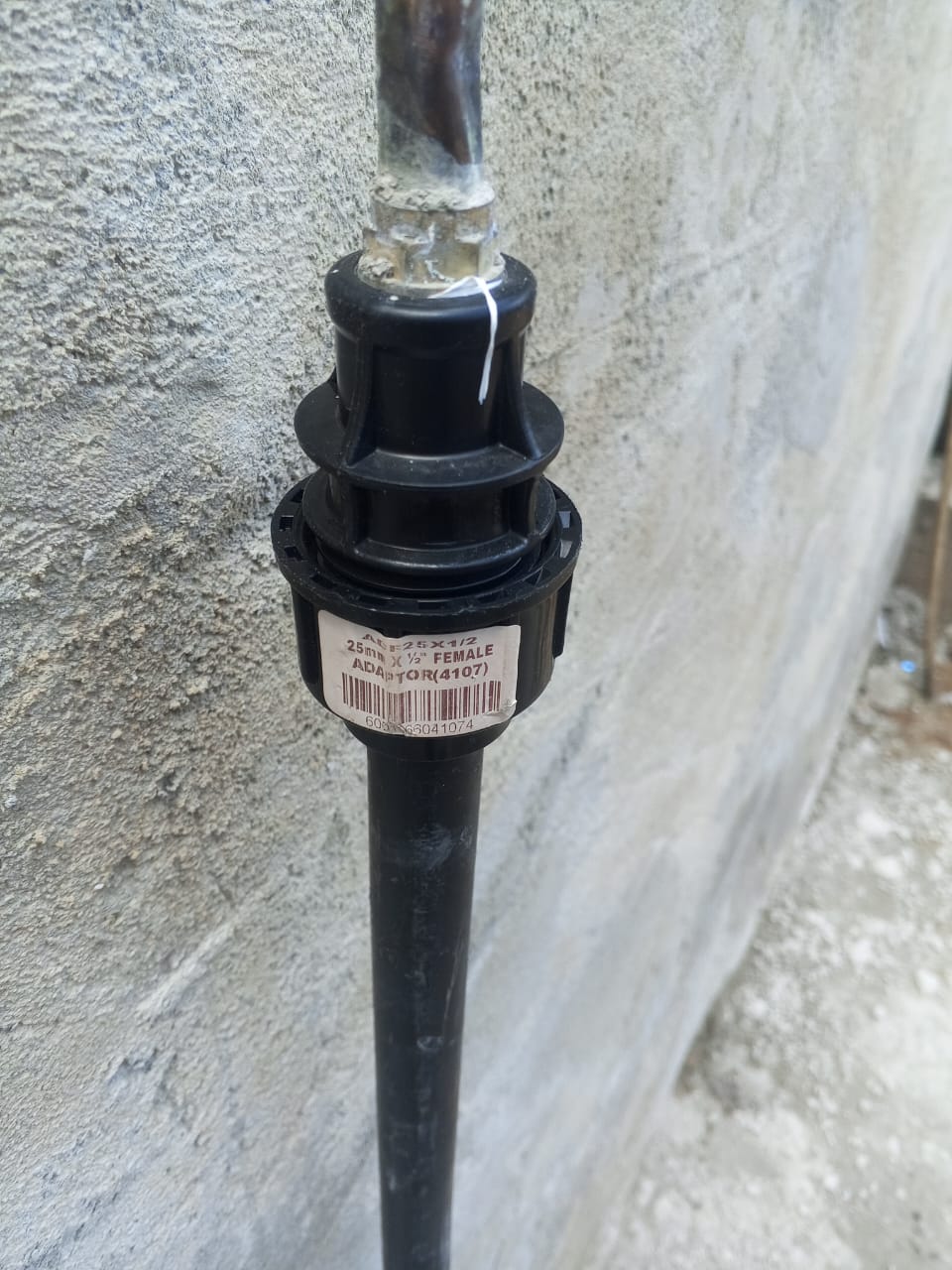 Pipe fitting on exterior wall