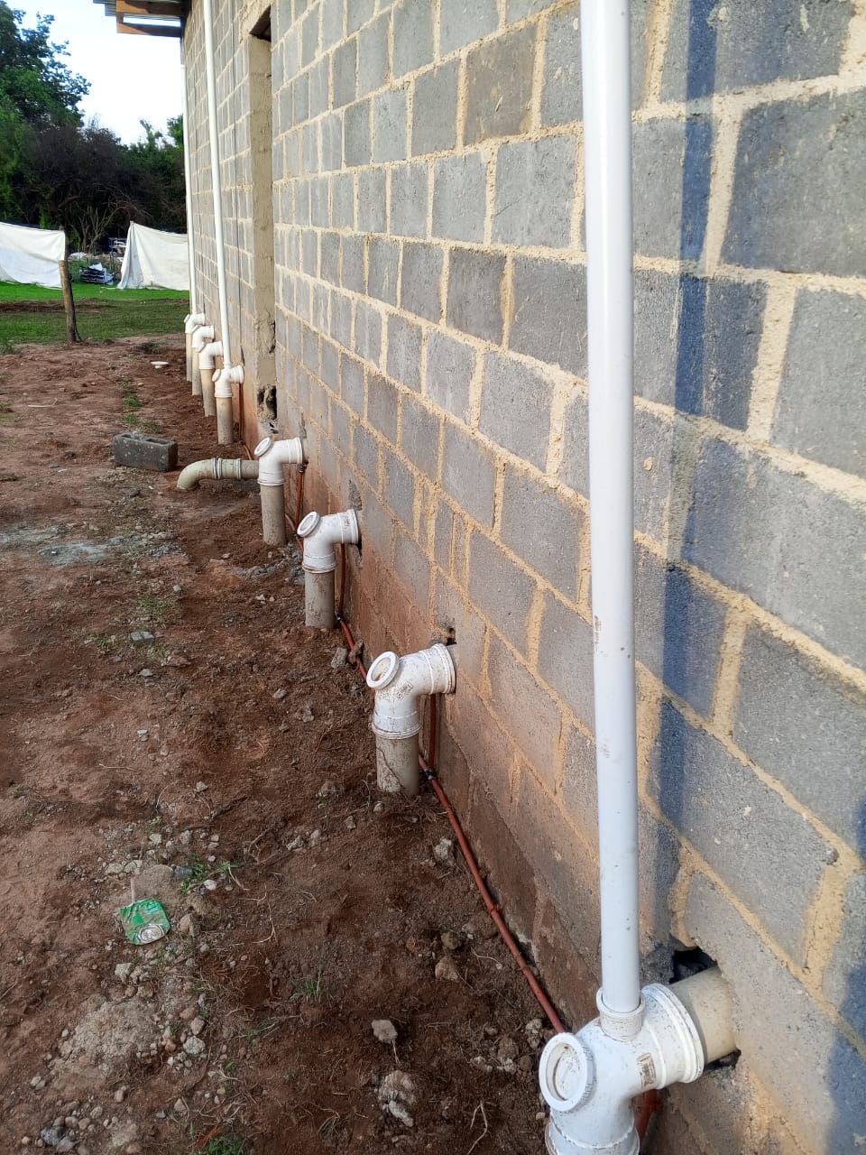 Drain system along building wall